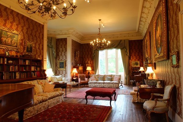 Sumtuous historic drawing room with log fire